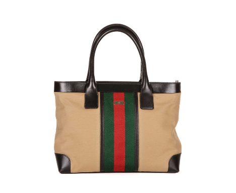 Gucci, a Web tote, designed with a beige canvas exterior with the maker's signature central web stripe in red and green, with