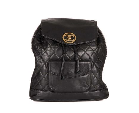 Chanel, a vintage black quilted leather backpack w/pouch, featuring gold-tone hardware, a front patch pocket, chain and inter