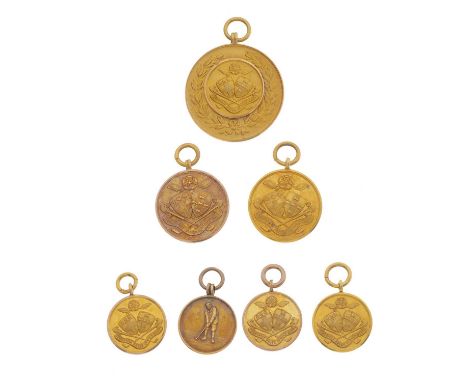 Golfing interest, a selection of seven gold championship medals, dated between 1897 and 1911, most with hallmarks, lengths 2.