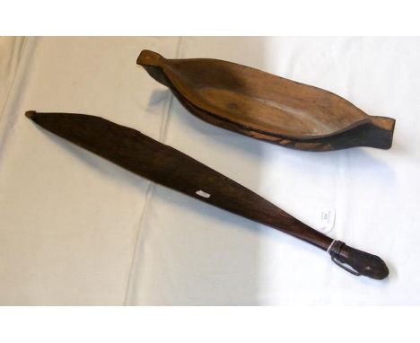 An old Australian aboriginal Woomera - 74cms, together with carved wooden boat hull