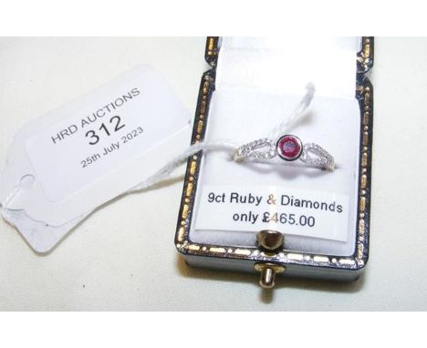 A new 9ct ruby and diamond ring in white gold setting