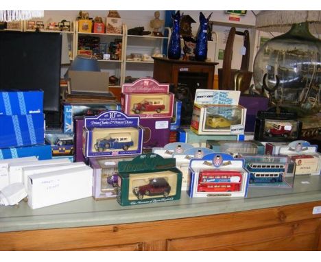 A collection of boxed die cast vehicles including Corgi