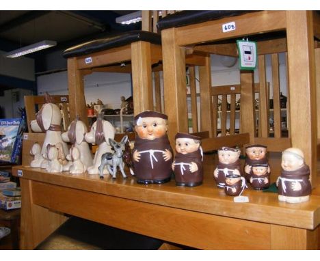 A collection of Sylvac 'sad-eye' dogs together with Goebel monk jugs etc. CONDITION REPORTsome paint loss and repair on monks