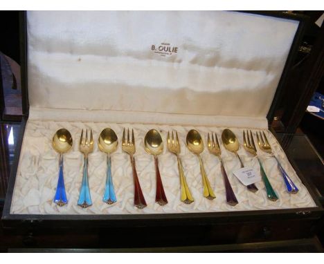 A set of sterling silver and enamel Norwegian dessert spoons and forks in presentation case