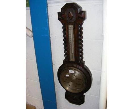 An oak cased barometer 