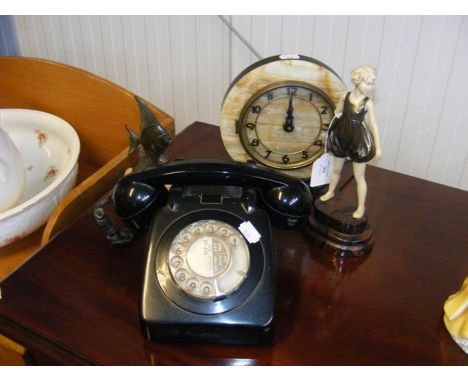 An Art Deco style mantel clock, together with statuette and turn dial telephone 