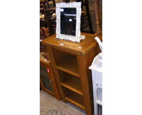 A light oak open bookcase - width 50cms, together with a easel mirror
