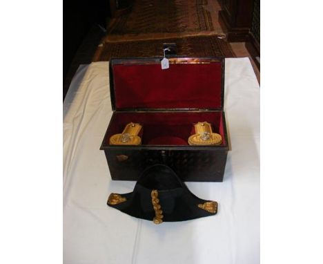 A set of Victorian Officers epaulettes and hat in metal case