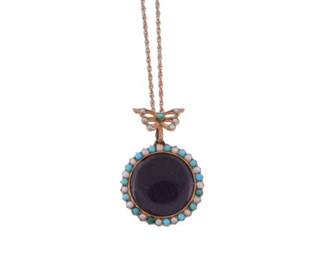  A turquoise and seed pearl locket pendant,   circa 1900, the circular glazed compartment within a surround of circular shape