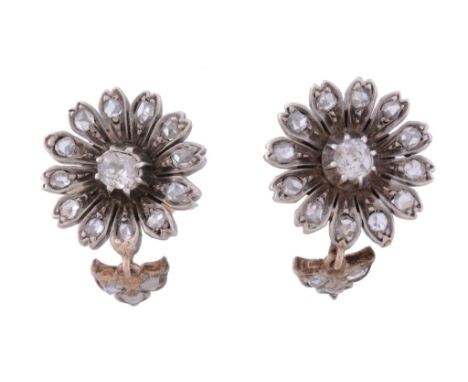  A pair of diamond flower head earrings,   circa 1900,    the flower head clusters set with a central old cut diamond within 