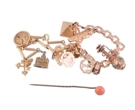  A gold coloured charm bracelet,   the striated baton shaped links suspending five charms including Fontana del Tritone, stam