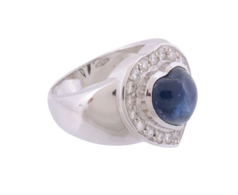  A sapphire and diamond ring,   the central heart shaped sapphire within a surround of brilliant cut diamonds, approximately 