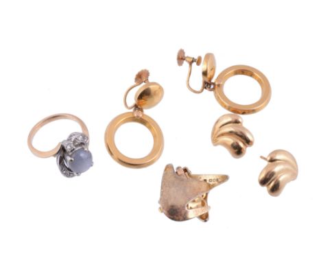  A star sapphire and diamond ring,   the oval cabochon star sapphire in a four claw setting, within a surround of brilliant c