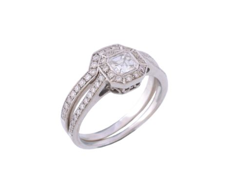  A diamond cluster ring,   the central ascher cut diamond stated to weigh 0.39 carats, within a surround of brilliant cut dia