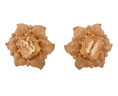  A pair of citrine earrings by Buccellati,   the rectangular mixed cut citrines within a gold coloured textured petal surroun