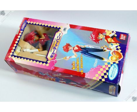 This is&nbsp;a&nbsp;CUTEY HONEY&nbsp;action figure toy made&nbsp;by&nbsp;BANDAI&nbsp;in 1997. Item stands approximately 50cm 