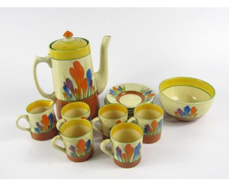 A Clarice Cliff pottery part coffee service, decorated in the Autumn Crocus pattern, comprising coffee pot, cream jug, sugar 