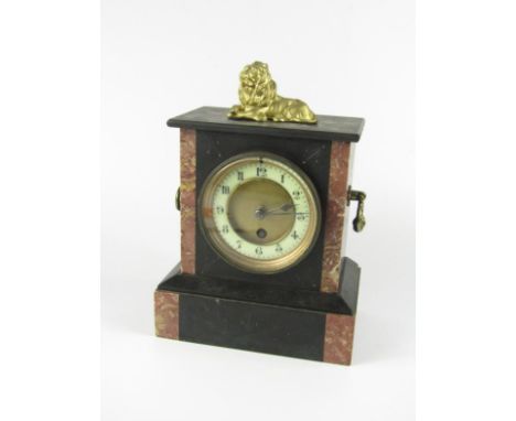 A Victorian slate and marble mantel clock, with recumbent lion surmount, brass dial with enamel chapter ring bearing Arabic n