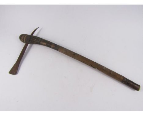 An early 20th century tribal axe, possibly Congolese, with carved decoration, 59cm long.