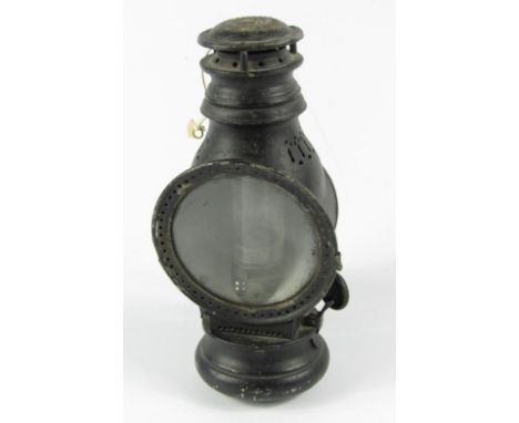 A carbine steam traction engine lamp, with mounting post.