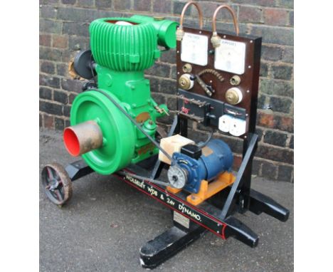 An early to mid-20thC Wolseley WD8 stationary engine, no. 44022 9068, in green with orange interior, attached to a volt and a