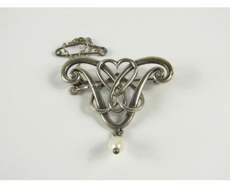 A modern Sterling silver brooch of Art Nouveau design, set with a pendant freshwater pearl.