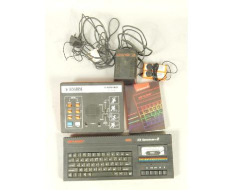 A Sinclair 2X Spectrum +2 computer, 128K memory, with manual, and a Binatone TV Master Mk IV.