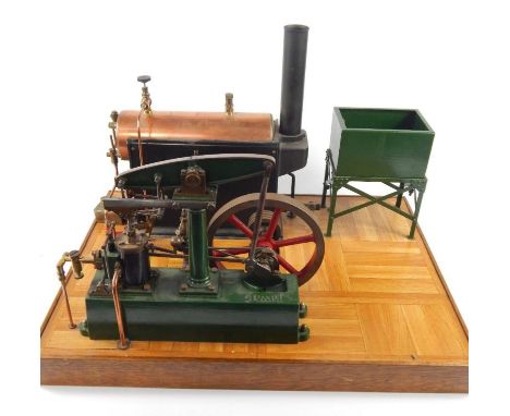 A partial horsepower table top live steam engine set, comprising piston pump run by 15cm dia. pierced drive wheel, with a cop