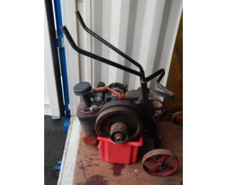 A mid-20thC Petter type A1 stationary engine no. 1509439, probably 1000 rotations per minute with 36cm dia. wheel no. 9340, o