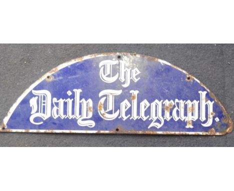 A demi-lune enamel sign for The Daily Telegraph, 49cm x 18cm.