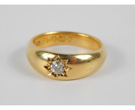 An 18ct gold and diamond solitaire gypsy ring, size K, approx 0.125cts, 5.90g.
