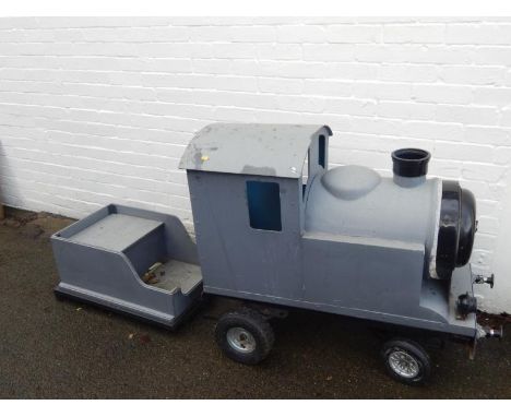 A scratch built gauge model locomotive carriage, in grey with black trim on rubber wheels, metal interior, lacking engine, 96