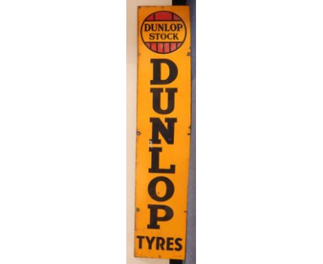 A Dunlop Tyres enamel sign, Dunlop Stock, in red, yellow and black, 152cm x 31cm.