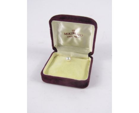 A Mikimoto cultured pearl tie pin, set in yellow metal, M stamped, boxed.