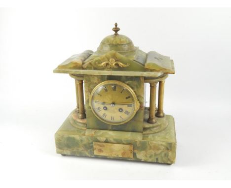 A French onyx and brass early 20thC mantel clock, of architectural form, engine turned brass dial bearing Roman numerals, eig