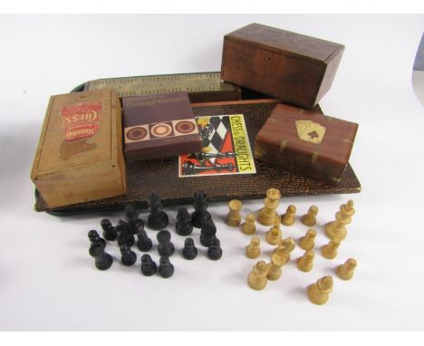 A Staunton wooden chess set, boxed, two boxes of draughts, brass mounted cribbage board, two chess boards and mahogany and br