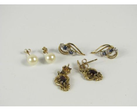 Three pairs of modern earrings, including a pair of cultured pearl studs.