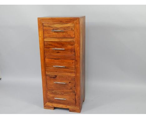 An Eastern hardwood chest of drawers, with five drawers, raised on bracket feet, 50cm x 40cm x 120cm.