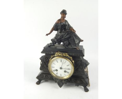 A French late 19thC spelter cased mantel clock, surmounted with a figure of Madame Recamier, enamel dial bearing Roman numera