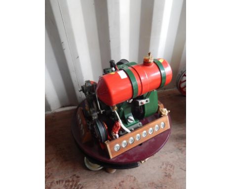 A stationary engine attached to stand, set to dynamos and various other figures to include Pinnochio, Chipmunks, etc., the un
