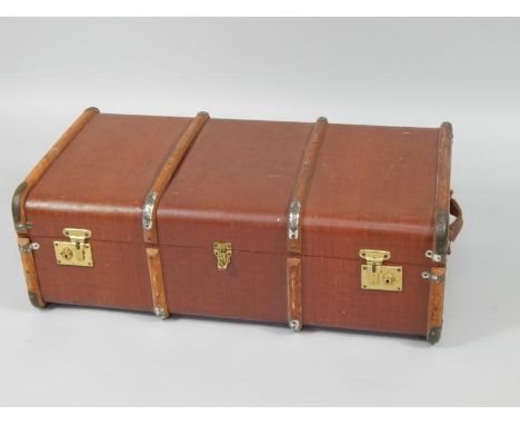 A bamboo bound canvas trunk, detailed to the lid 'Peter Ewen RC21', 92cm x 51cm x 32cm.