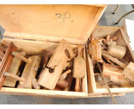 Two tool chests containing late 19th/early 20thC moulding planes, saws, mallets, braces, hammers and a blow torch, and sundry