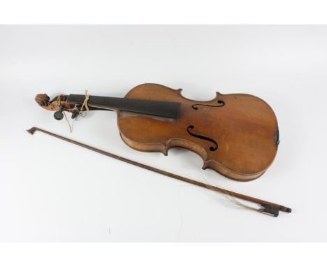 A 19thC violin, with two piece back, bears label inscribed of Antonius Stradivarius made in Germany, back measures 35.5cm, an