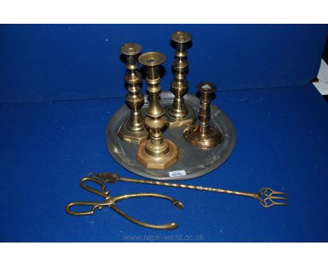 Four Brass Candlesticks, a pair of tongs and toasting fork, together with Pewter tray