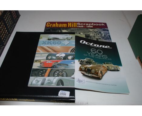 Three Jaguar car books and a Graham Hill scrap book.
