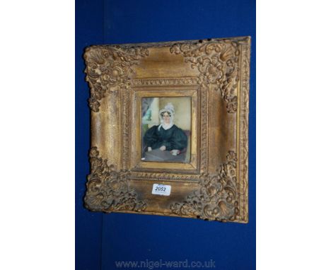A Watercolour Portrait of a 19th C. lady on alabaster panel, in heavy gilt frame, 4 1/4'' x 5''.