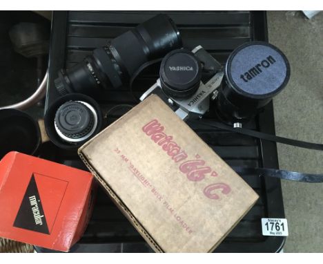 A small collection of cameras lenses and a Yashica camera. NO RESERVE