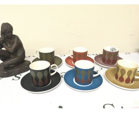 A Modern design Wedgwood Coffee service Susie Cooper Design multi coloured set and simulated bronze sculpture.