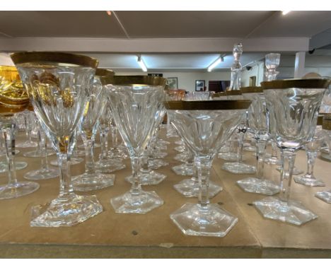 A suite of Moser crystal glassware in the Lady Hamilton pattern. With etched gold borders and flat cut decoration. 4 seats of