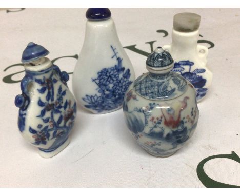 An interesting Chinese porcelain scent bottle with revolving central sections the sides decorated with figures and underglaze